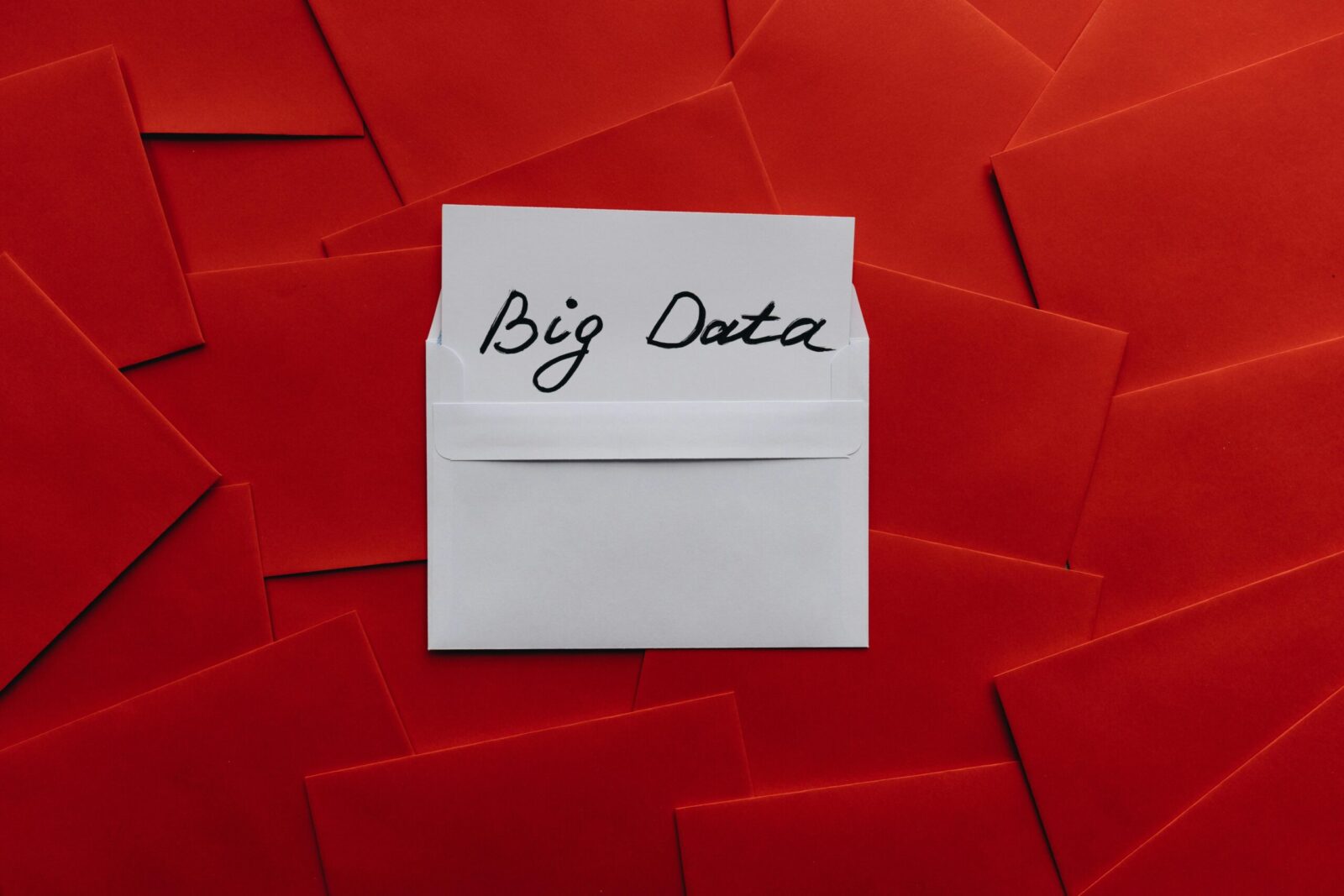 White envelope with 'Big Data' text on red envelope background. Conceptual digital imagery.