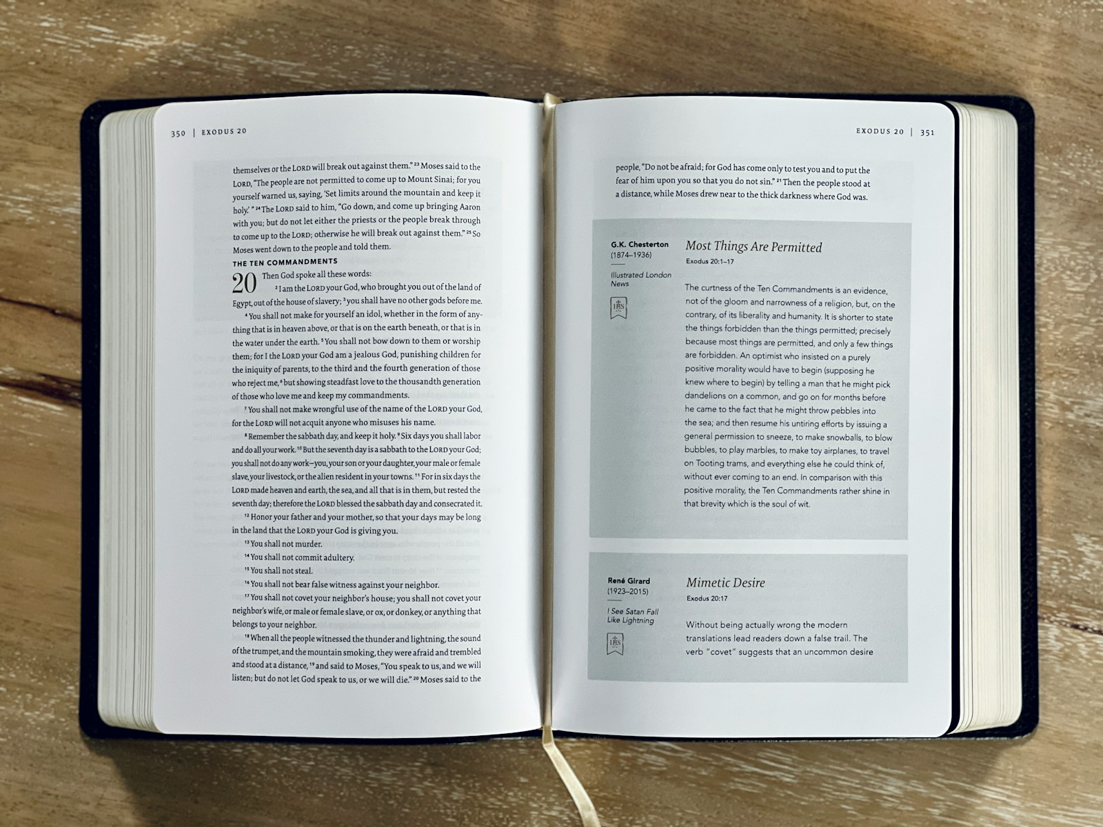 an open book sitting on top of a wooden table